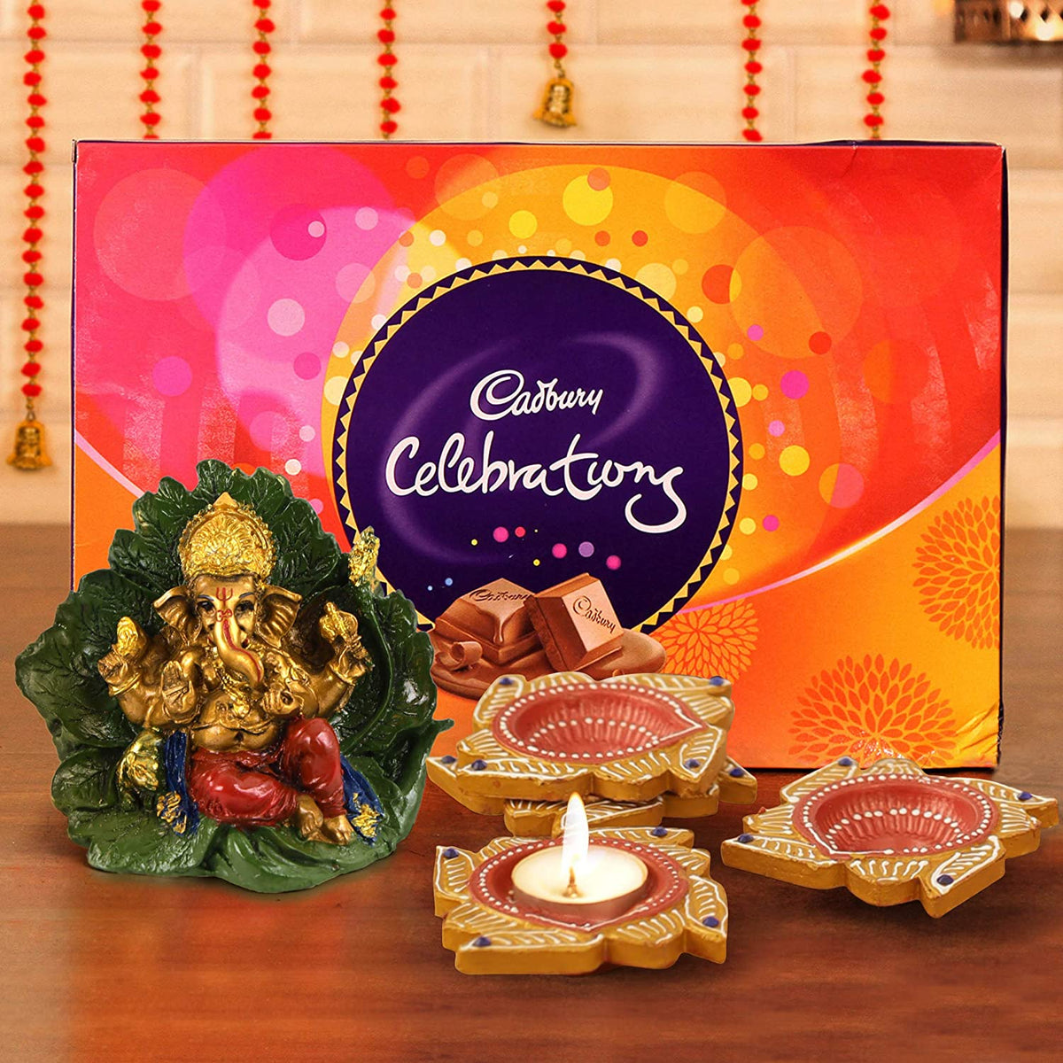 Alluring Ganesh Murti With Diya N Cadbury Celebrations