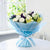 Candid Moment - Yellow And White Flower Bouquet- Online Flower Delivery In Category | Flowers | Exotic Flowers -Product Details: 10 White Roses 3 Yellow Asiatic Lily Blue Paper packing Seasonal Fillers Do you want to express your young, innocent and sweet love to your dear and near ones? The set of 10 White Roses and 3 Yellow Asiatic Lily is a perfect choice as these beautiful flowers signify the same feelings. What is even better than offering these flowers with blue paper packing? It further personifies the beauty of the flowers. While we always strive to ensure that products are accurately represented in our photographs, from season to season and subject to availability, our florists may be required to substitute one or more flowers for a variety of equal or greater quality, appearance and value.     