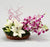 Our Passion For Flowers- Flower Delivery in Category | Flowers | Flowers For Father -This Father's Day Special Flowers Contains : 4 Purple Orchids & 2 Stem White Asiatic Lillies Seasonal fillers Nicely arrnaged in a Basket While we always strive to ensure that products are accurately represented in our photographs, from season to season and subject to availability, our florists may be required to substitute one or more flowers for a variety of equal or greater quality, appearance and value. 