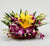 Basket Ful Of Happiness- - Send Flowers to India -This Mother's Day Special flower contains : 2 Stem yellow Asiatic Lily and 8 Stem Purple Orchids Nicely arranged in a basket While we always strive to ensure that products are accurately represented in our photographs, from season to season and subject to availability, our florists may be required to substitute one or more flowers for a variety of equal or greater quality, appearance and value. 