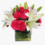 Exotica By Bloomsvilla- Flower Delivery in Category | Flowers | Miss You Flowers -This special basket flower arrangement consists of: 15 Pink Carnation 5 Pink Lily Square Vase Seasonal fillers While we always strive to ensure that products are accurately represented in our photographs, from season to season and subject to availability, our florists may be required to substitute one or more flowers for a variety of equal or greater quality, appearance and value. 