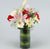 Pearl Of Love- Flower Delivery in Zirakpur -This Mother's Day Special flower contains : 2 Stem Pink Asiatic Lily, 6 Stem White Gerbera and 6 Stem Red Carnations Nicely arranged in a vase While we always strive to ensure that products are accurately represented in our photographs, from season to season and subject to availability, our florists may be required to substitute one or more flowers for a variety of equal or greater quality, appearance and value. 