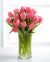 Pink Tulips In Glass Vase--This beautiful arrangement consists of: 10 pink tulips Crystal clear glass vase Note: This product is available for delivery in Bangalore city only. 
