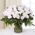 Pure Emotions--This beautiful flower arrangement contains: 45 White Rose Beautiful glass vase Seasonal fillers While we always strive to ensure that products are accurately represented in our photographs, from season to season and subject to availability, our florists may be required to substitute one or more flowers for a variety of equal or greater quality, appearance and value. 
